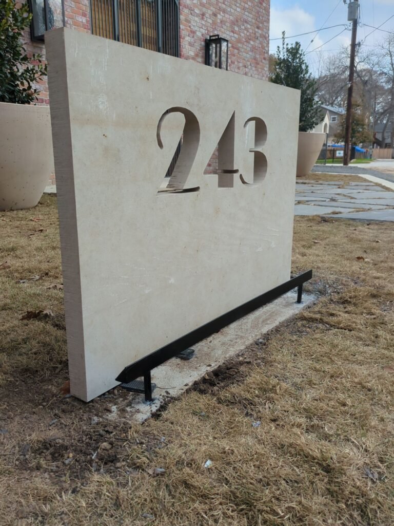 Hardscape lighting on a street number.